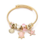 Arany színű teknősös pandora stílusú charm kristályos karkötő - Rózsaszín